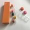 Le tiroir multicolore en carton ondulé Macaron enferme dans une boîte pour 12 avec intérieur en plastique
